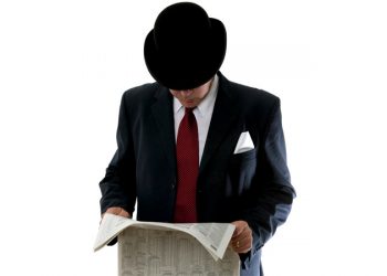 Stockbroker-reading-newspaper-businessman-700.jpg