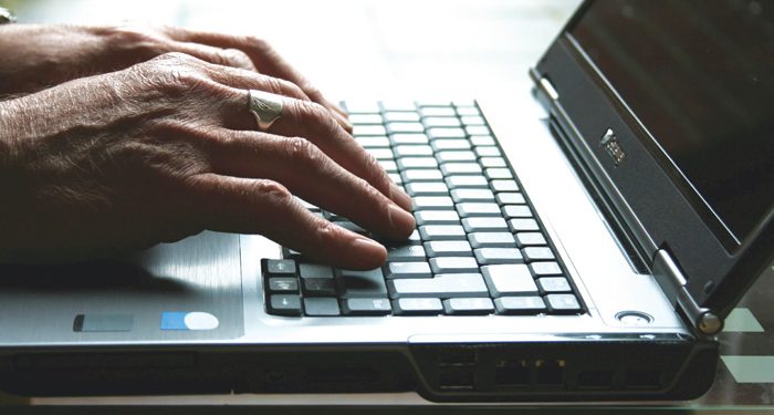 laptop-keyboard-hands-elderly-pensioner-700.jpg
