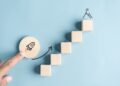Business growth success achievement concept; hand of people arranging as step stair or ladder rocketship launch for planning development leadership and customer target group concept.