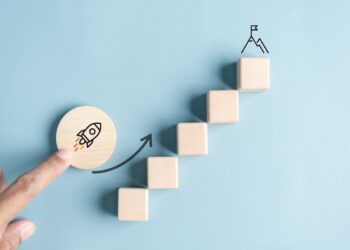 Business growth success achievement concept; hand of people arranging as step stair or ladder rocketship launch for planning development leadership and customer target group concept.