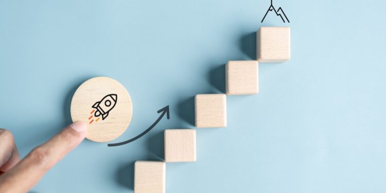 Business growth success achievement concept; hand of people arranging as step stair or ladder rocketship launch for planning development leadership and customer target group concept.